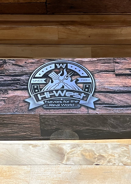 Hi-West Gift Box showcasing diverse BBQ flavors on a rustic wooden design. Perfect for grilling enthusiasts.